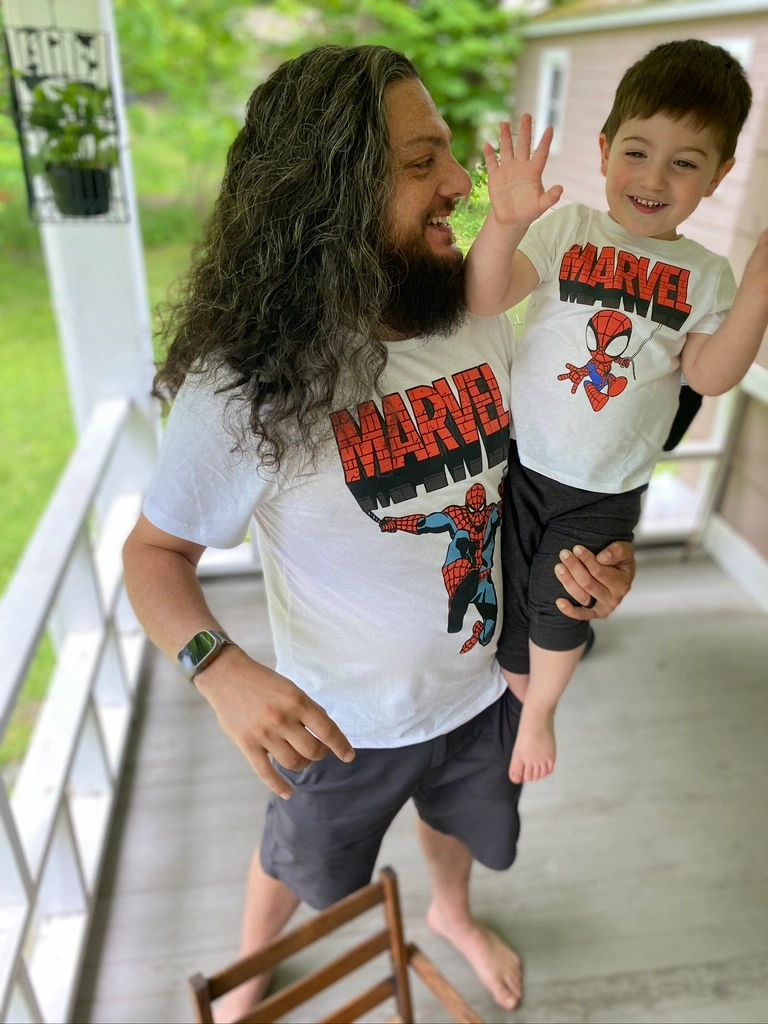 Tommy holding a guitar